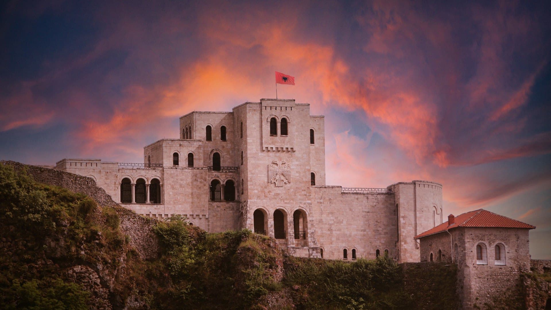 Kruja Castle above the town at sunset