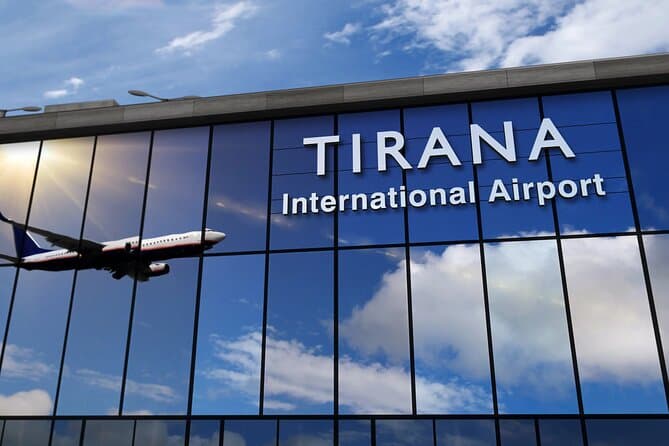 Tirana International Airport terminal with plane reflection